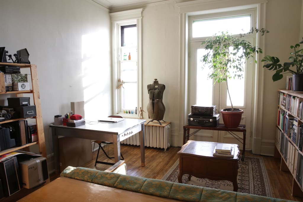 Living room/study with a place for computer work. Receives afternoon light.