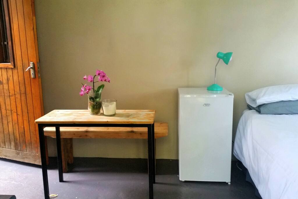 A table and bench is available for eating or laptop working (there is wifi and a plugpoint with extension cord).