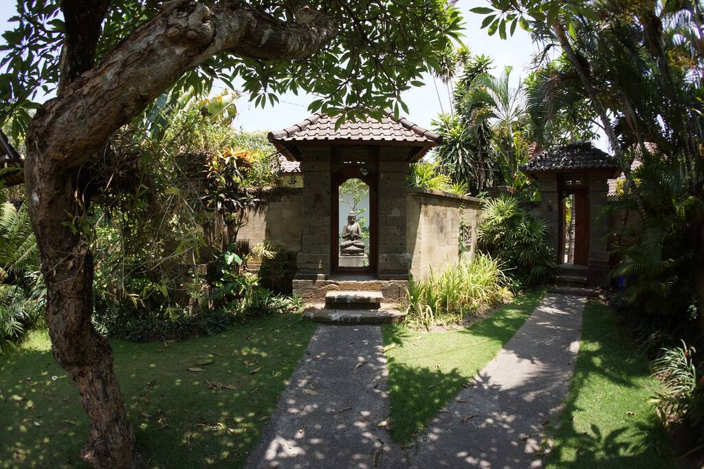 Entrance to garden. Covered parking for 1 car and motorcycles just out of shot to the left