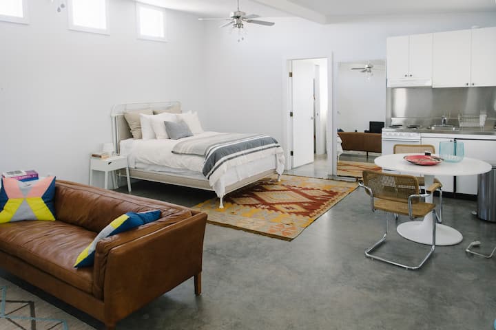 Retire to the bedroom casita after a day out.  The structure features comfortable queen bed, sitting area with sofa and TV, and table area.  There's also a large walk-in closet and full bathroom.