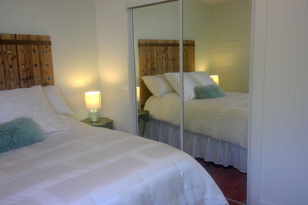 Master bedroom with Luxury linens, full size closet, pillow top queen bed mattress, cherry wood floors. Master bedroom. Colors and furniture decorated to create a quite restorative room