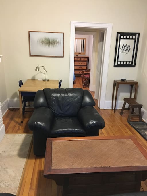 Large living room. Dining table and couches.