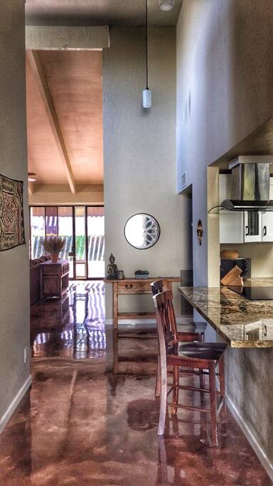 Entryway view from the front door with eat-in kitchen peninsula