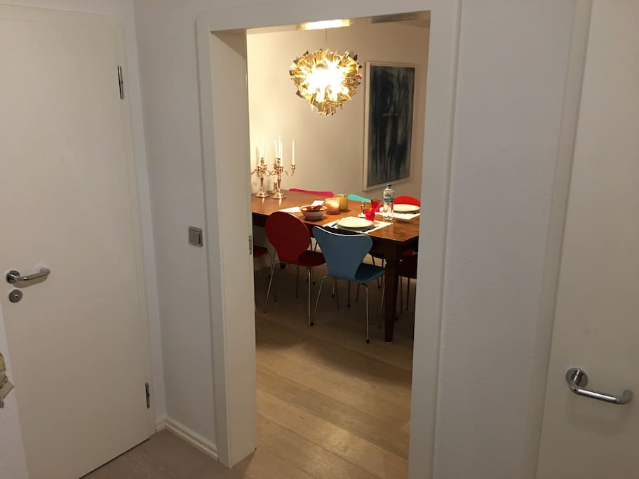 Entrance, to the left is the guest bathroom, to the right a tiny storage room, and straight ahead the living room with balcony