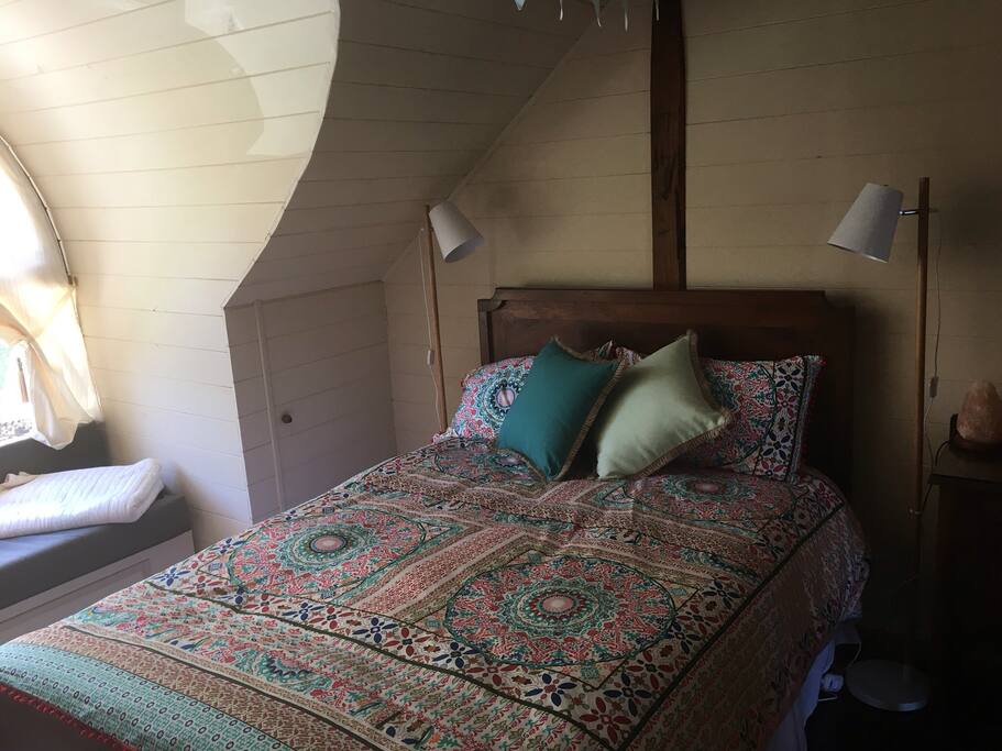 The main bedroom . Sun filled window seat .