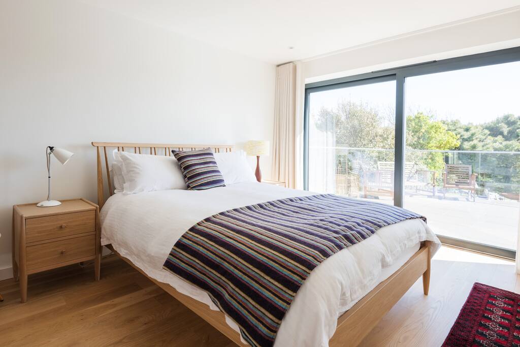 Master bedroom with sliding patio doors onto terrace. Ensuite shower room.