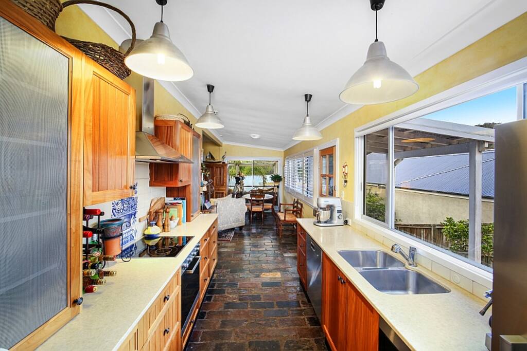 Our galley kitchen is very well-appointed with a Miele oven, cook top, and convection oven. A Sunbeam Cafe Series Espresso machine is also available. There is a herb garden just outside the door.