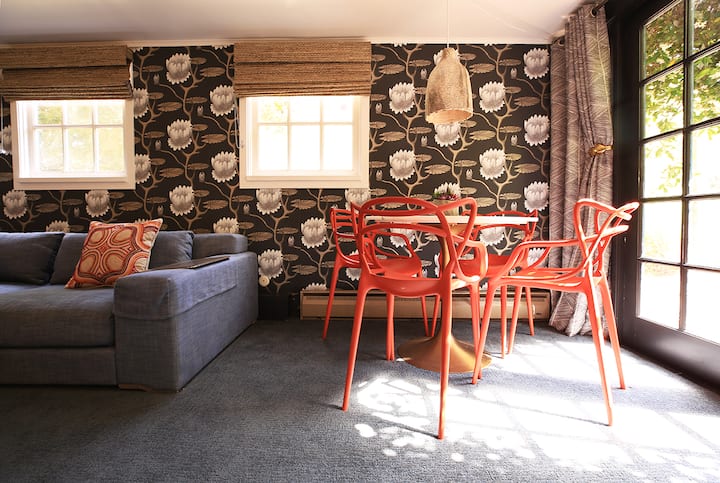 Room No. 1 is a studio apartment, ideal for small families. Formerly the innkeepers unit, this ground-level room includes a queen bed, full bath w/tub-shower, living space w/couch, dining table, + a petite galley kitchen. Dbl-doors to private patio.