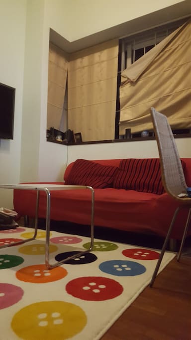 air-conditioned room, sofa bed right by the window, curtains can be drawn up