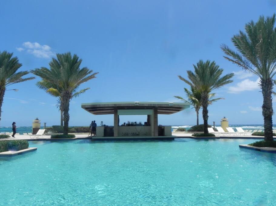 Hotel pool with 2 basins + bar.