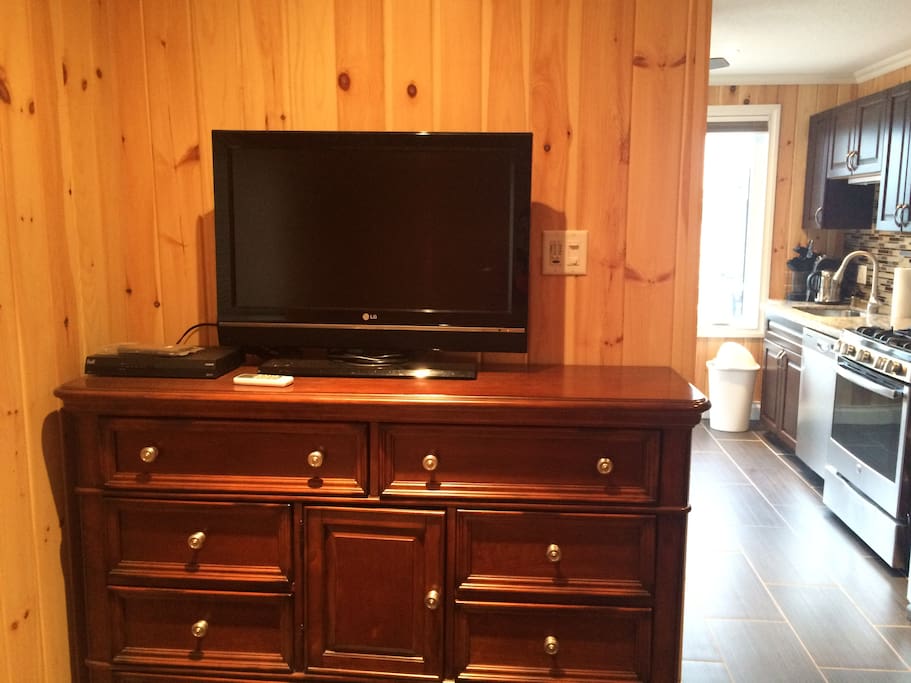 Satellite TV and Dresser in Bedroom