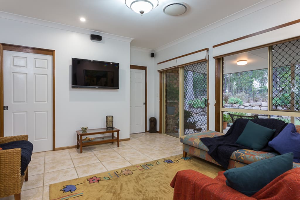 Spacious, light living area with tv, plus front and rear patios.