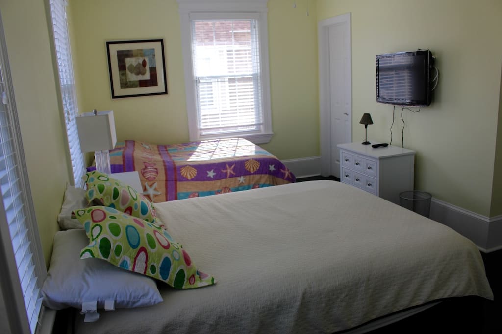 bedroom #3 with 2 queen beds. folding crib available for use and stored in the closet.