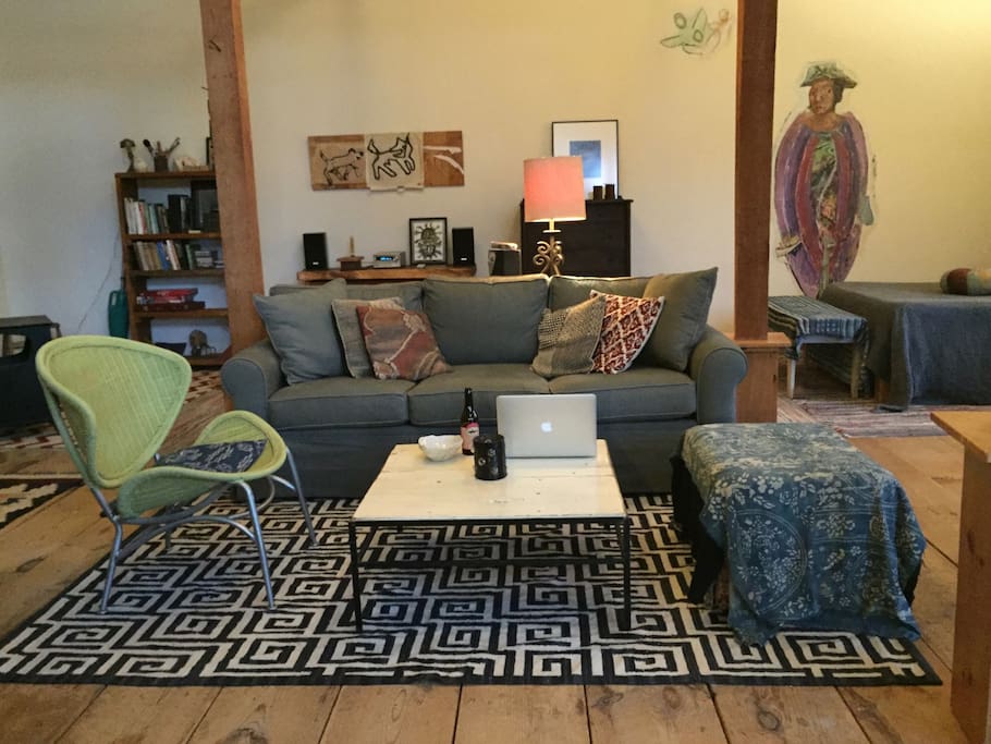 Seating area with downstairs bed in rear on right.