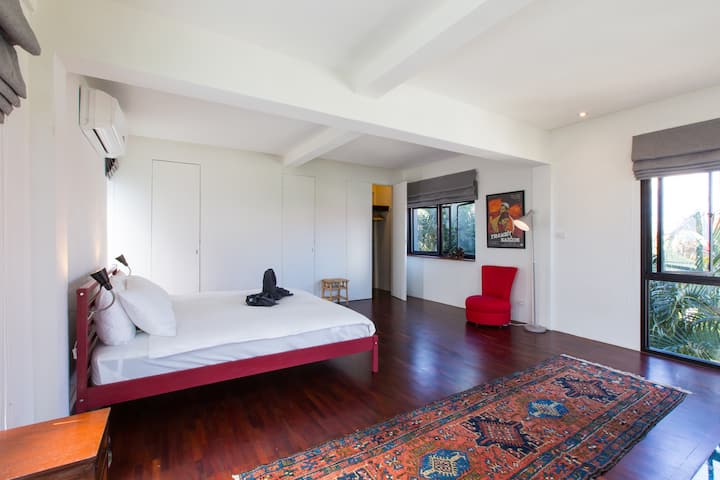 The bed room is spacious and has a clean look.