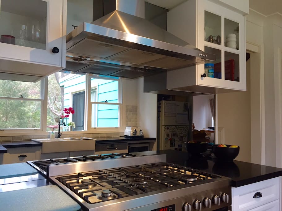 Newly renovated kitchen with mirror splash back to reflect the outside