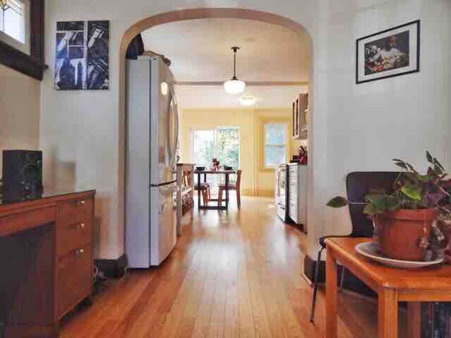 This is the open concept living and dining rooms. Lots of light from the many windows, and you can step outside to the back deck through the patio door in the kitchen.