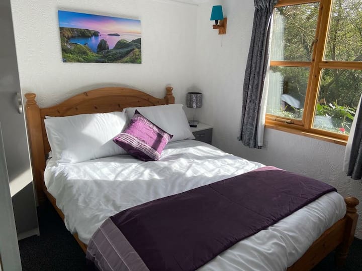 Bedroom with double bed, wardrobe, bedside cabinet with lamp and 32" tv/dvd player (all new including mattress but excluding bed August 2020)