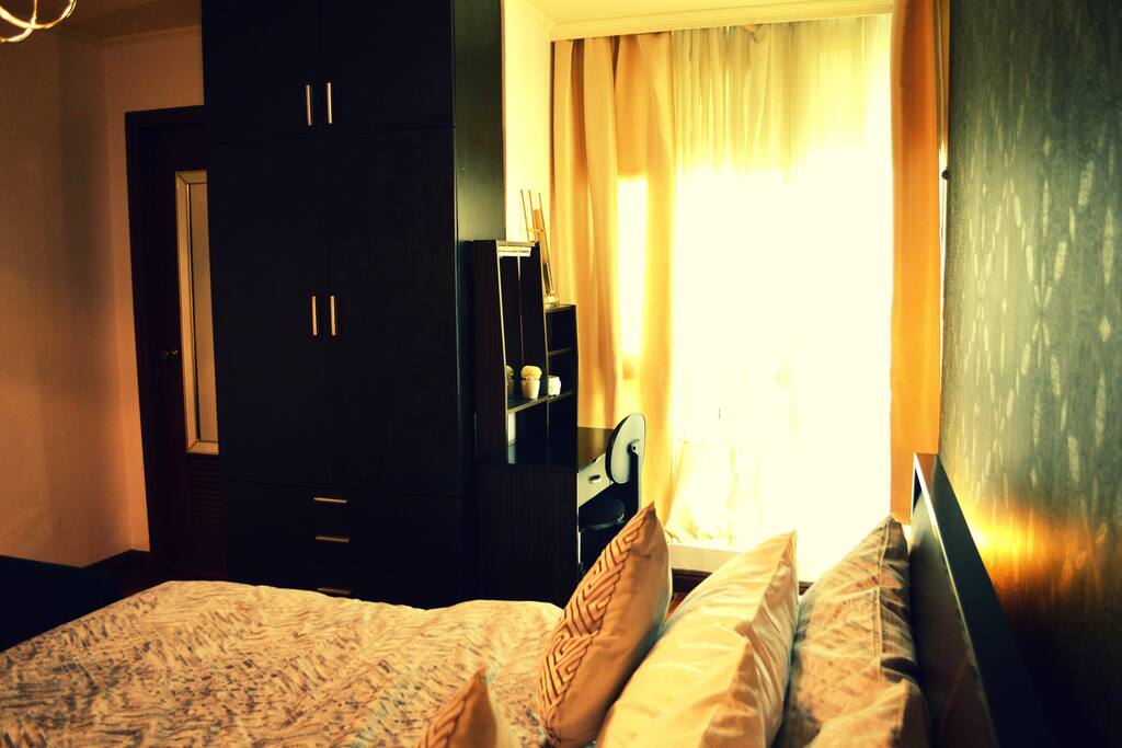 Well-lit room with floor-to-ceiling glass panel