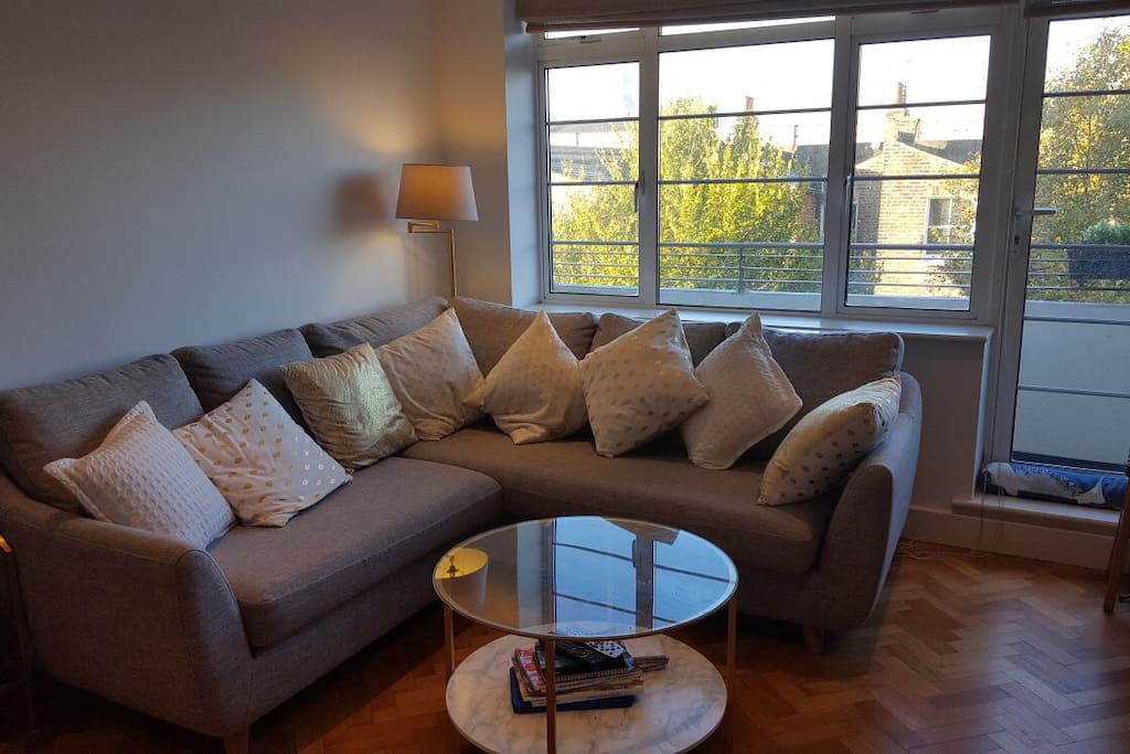 Large comfortable sofa with coffee table and west-facing view
