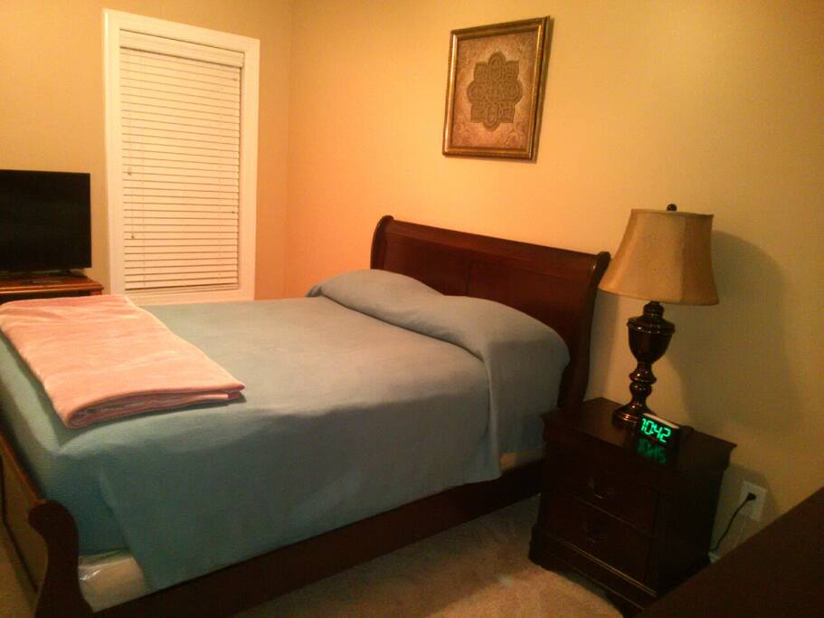 Bedroom with TV and full size bed