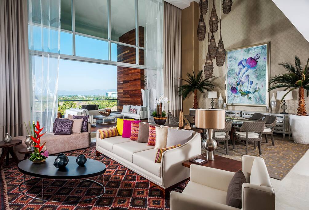 Luxurious living and dining areas with ocean view