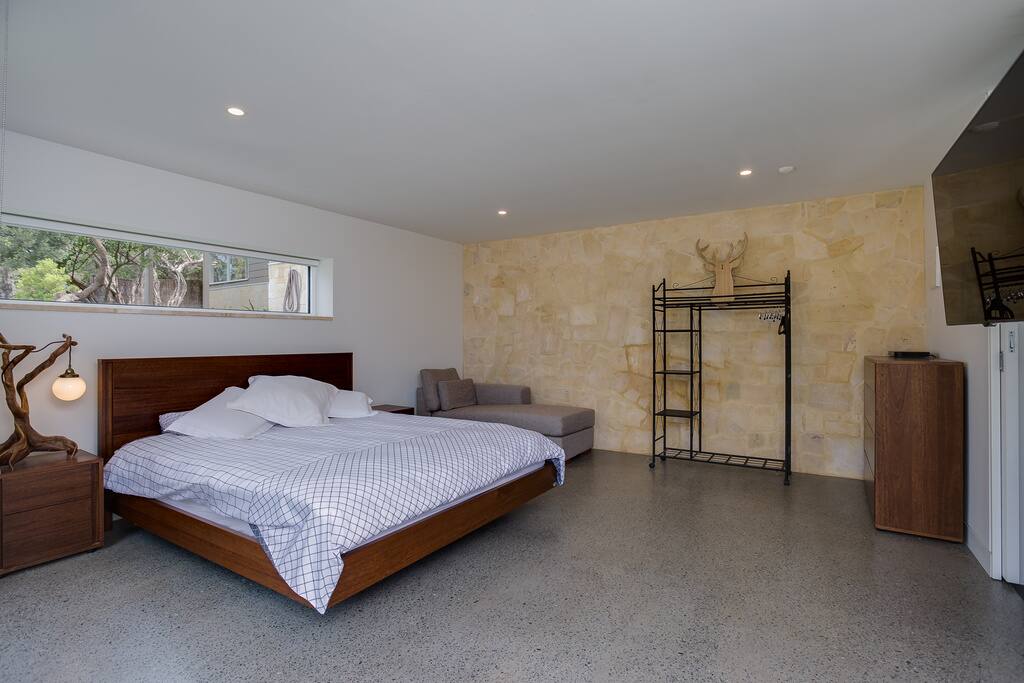 King size retreat with luxe ensuite, deep soaking bath & cloud shower.
