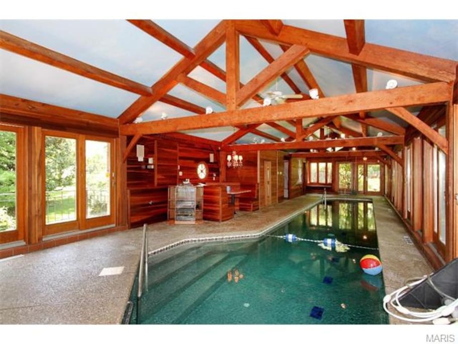 Far end of pool. 2nd entry stairs adjacent to dining booth, fireplace, and stereo
