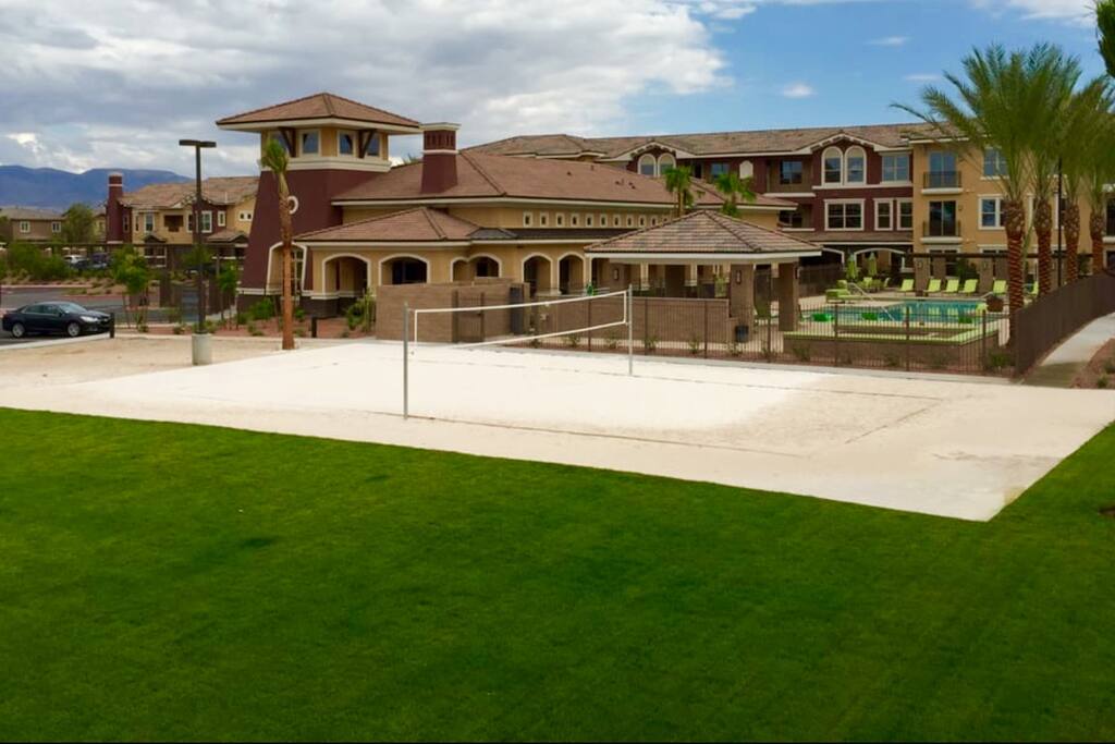Sand volleyball court adjacent to outdoor fireplace usable 24hours