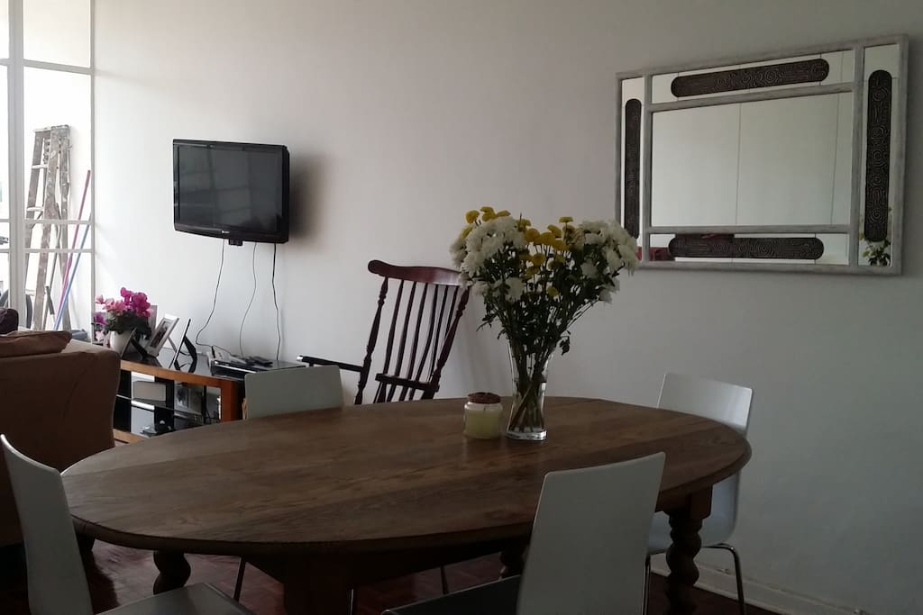 Open dining area and lounge leading onto outside balcony