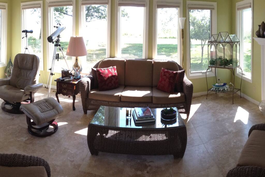 Panorama view of four season porch overlooking lake...