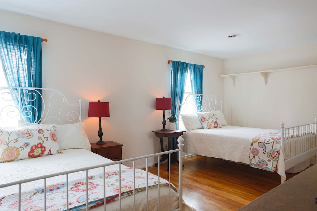 Upstairs Bedroom Sleeps 6
2 Queen Beds
2 Twin Mattresses pull out from under beds.
Smart TV with 250+ channels. Empty closet and dresser for cloths.