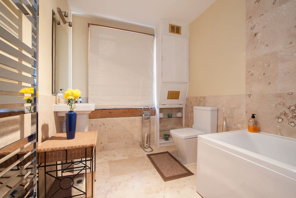 Travertine Italian marble bathroom with shower just a step away