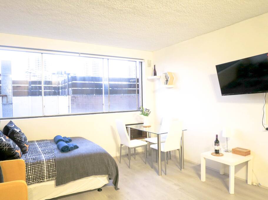 Very spacious area with bed, lounge set, dining table/desk, 39 inch tv... and the best part of it .. its all new!