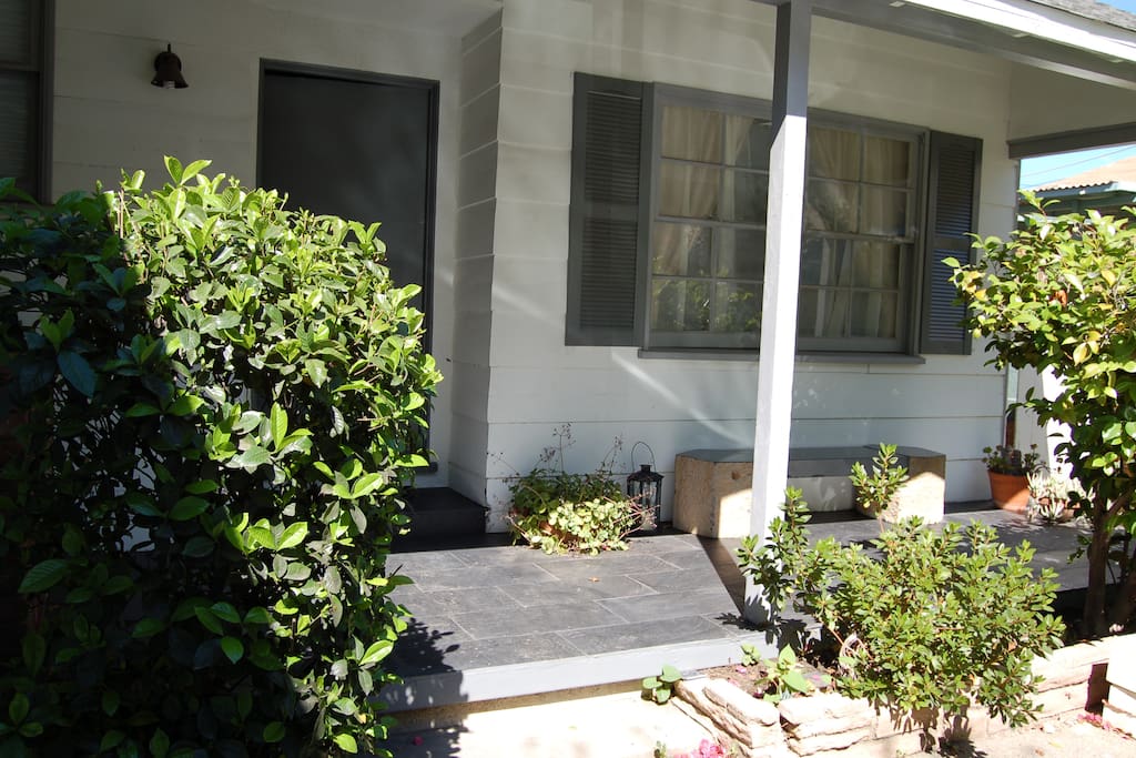 Front Porch with bench seating to enjoy your coffee.
