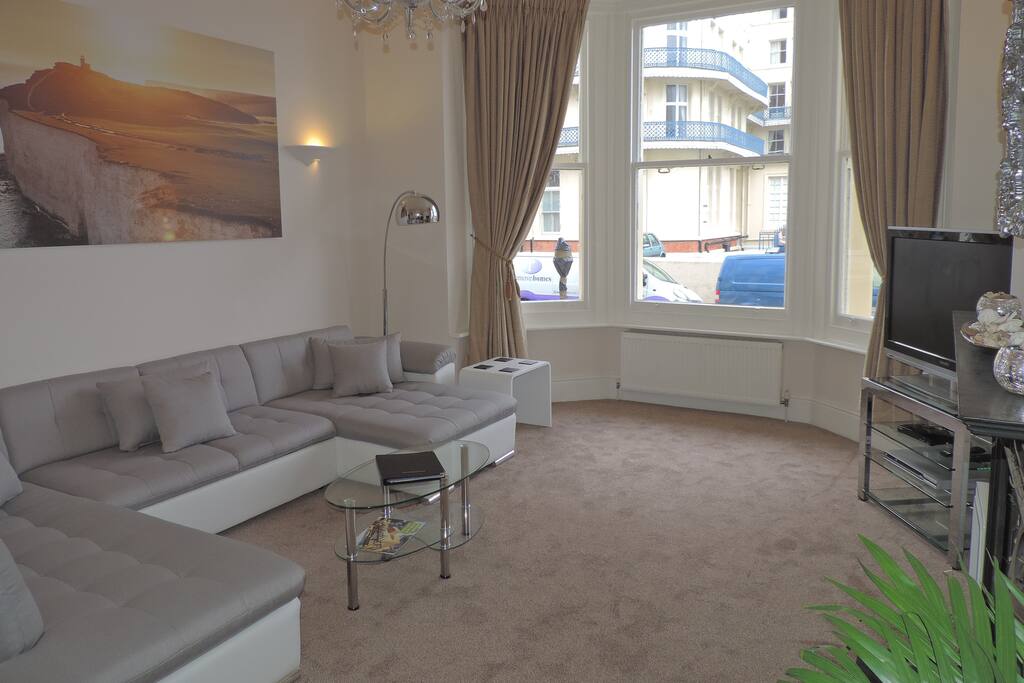 The large U-shaped sofa bed is perfect for watching the boats on the water