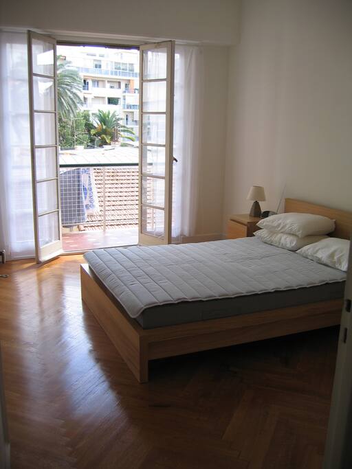 Quiet bedroom with french doors to the south-facing, sunny balcony. The rooms face the courtyard so they are quiet at night. Cupboards available for clothes (hangers & drawers).