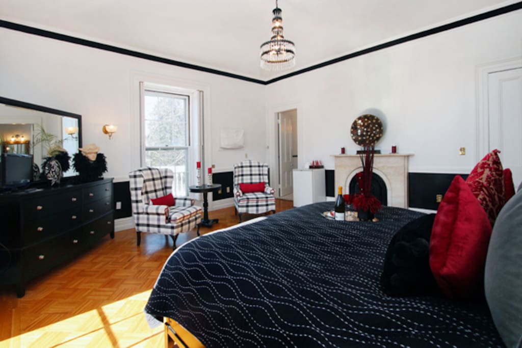 King bed, light bright room with a refridgerator, iron, ironing board and own large bathroom with walk-in shower