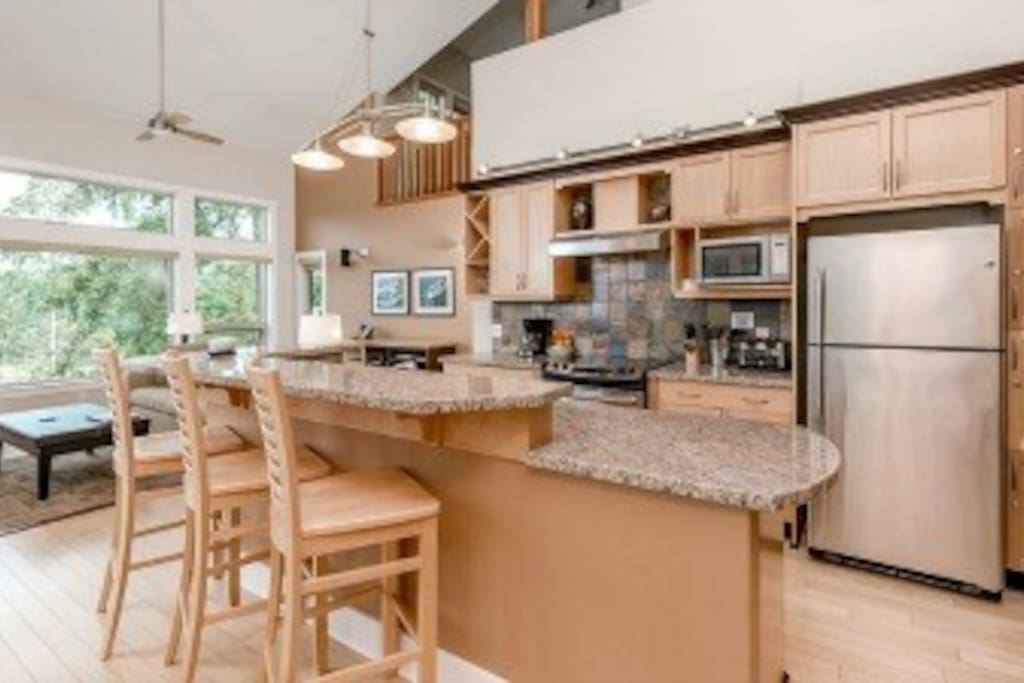 Gourmet kitchen with breakfast bar plus formal dining area