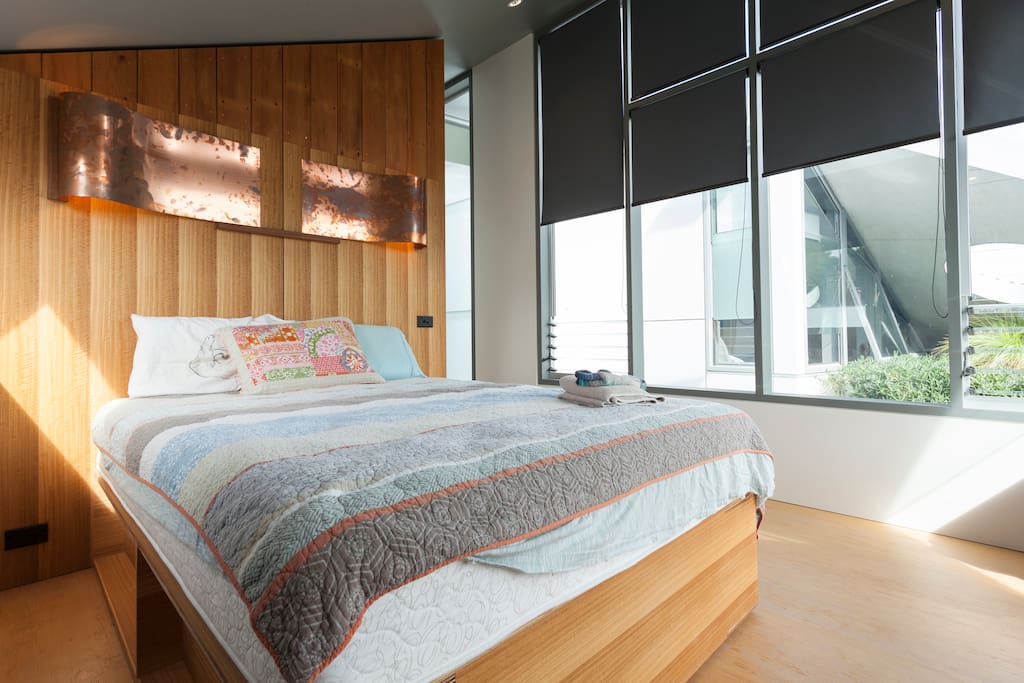 Your room with bespoke hand-crafted bed and loads of natural light and greenery