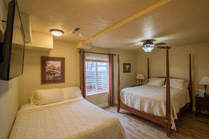 This bedroom has 2 queen beds a private bathroom