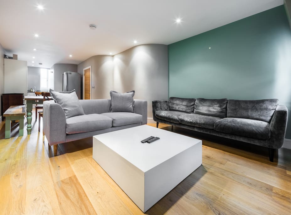Spacious bright living area with lots of comfy seating