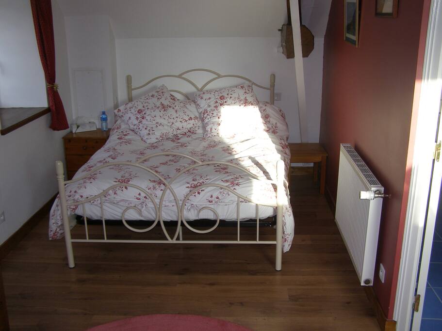 Upstairs is a large sleeping area with a double bed (pictured) and single bed. All linen provided.