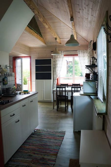 View from the entrance: kitchen to the left, living room at the far end