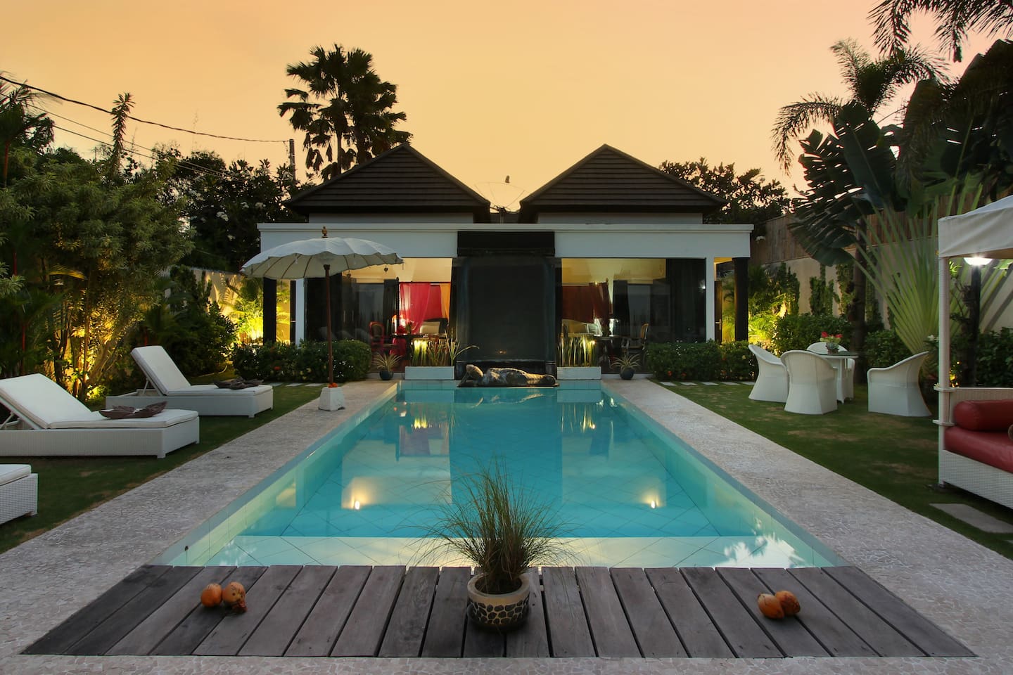 Beautiful view of one part of the property at the sunset. One bedroom on each side of the fountain.