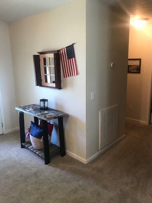 Entryway and hallway leading to bedrooms 1-3