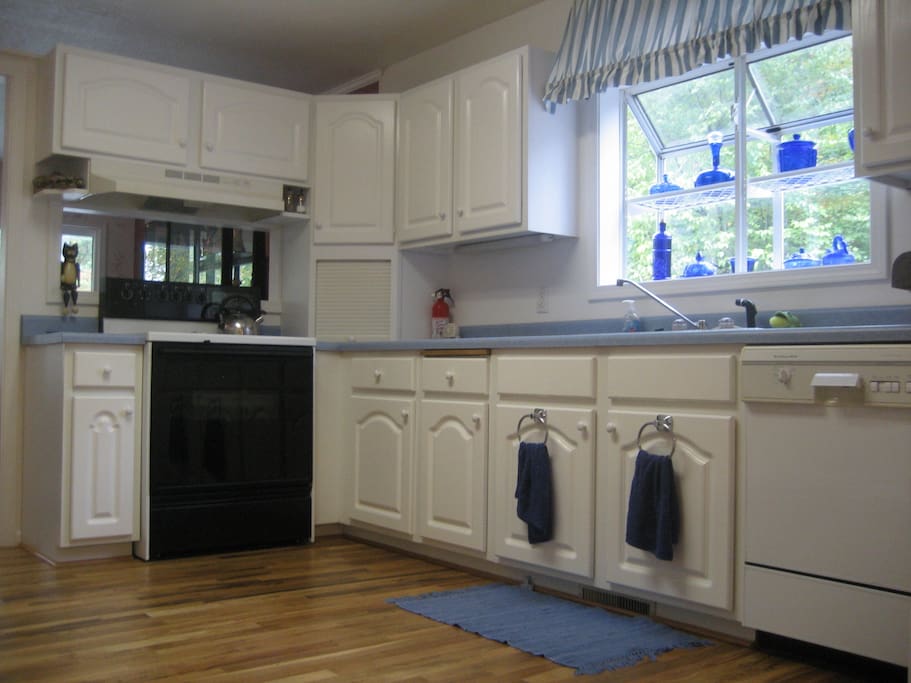 Full kitchen with all dishes, unsettle, pots and pans. Toaster, coffee maker, microwave, dishwasher, refrigerator.