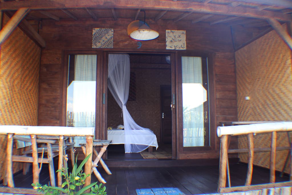a classic room with a very traditional bamboo stail making room equipped with ac, wifi, warm water, and double bed, perfect for those of you who long for a rustic atmosphere with modern facilities