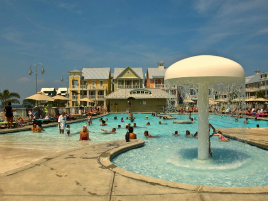 Zero Entry Outdoor Pool with mushroom waterfall. There is also an additional kiddie pool.