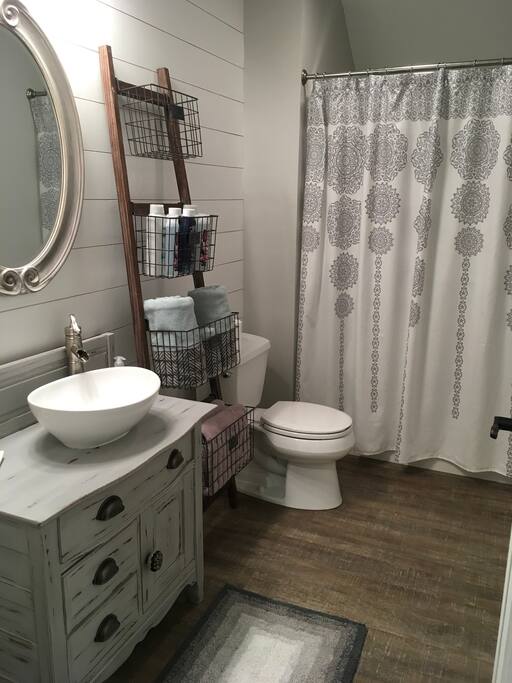 Private bath with shower beside this bedroom.